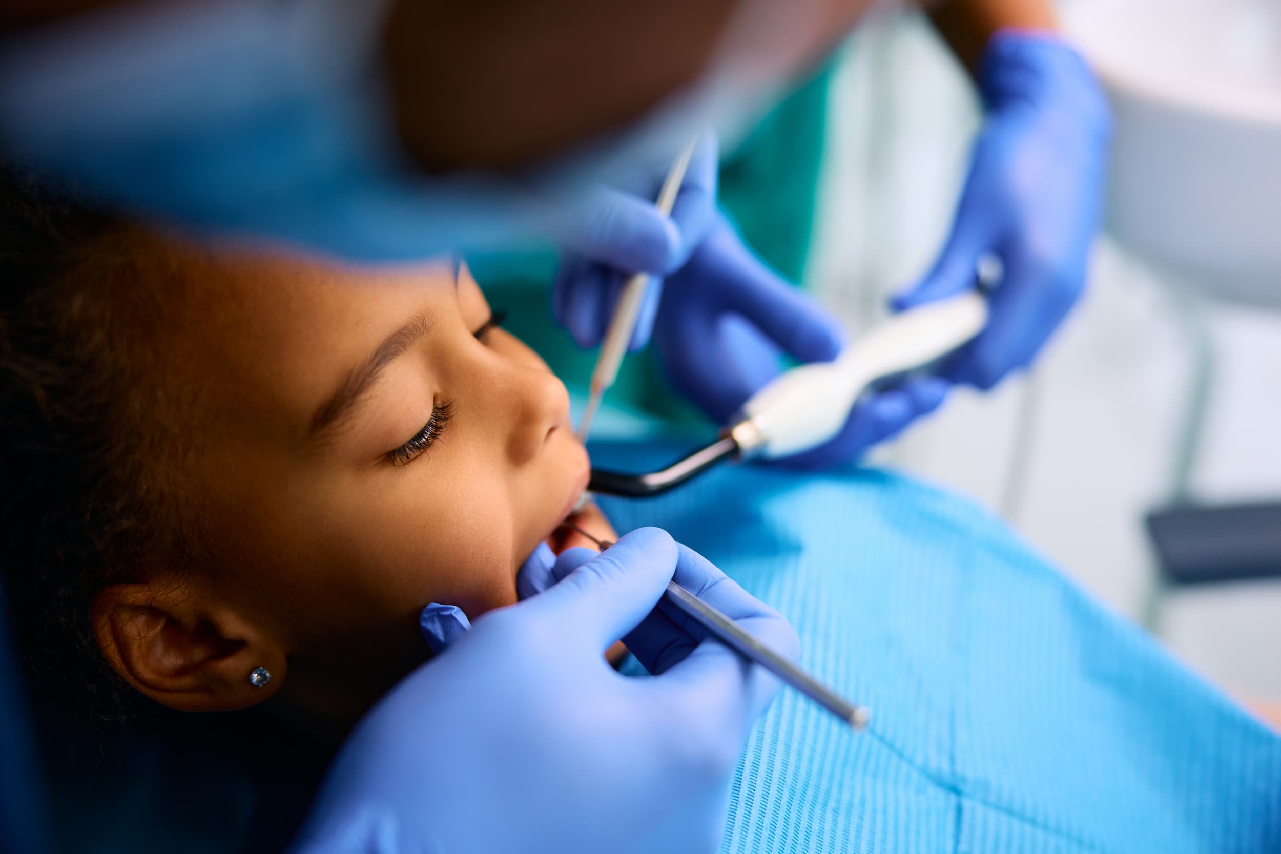 Child receiving gentle dental care during a paediatric check-up