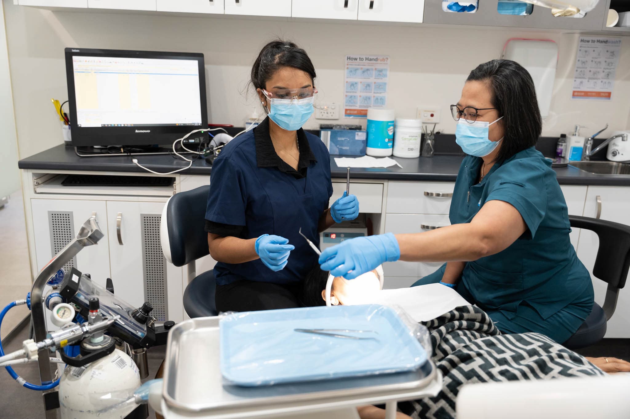 Dr Vaidehi Trivedi and Wilmina Rovillos Warner dental team at Exquisite Smiles