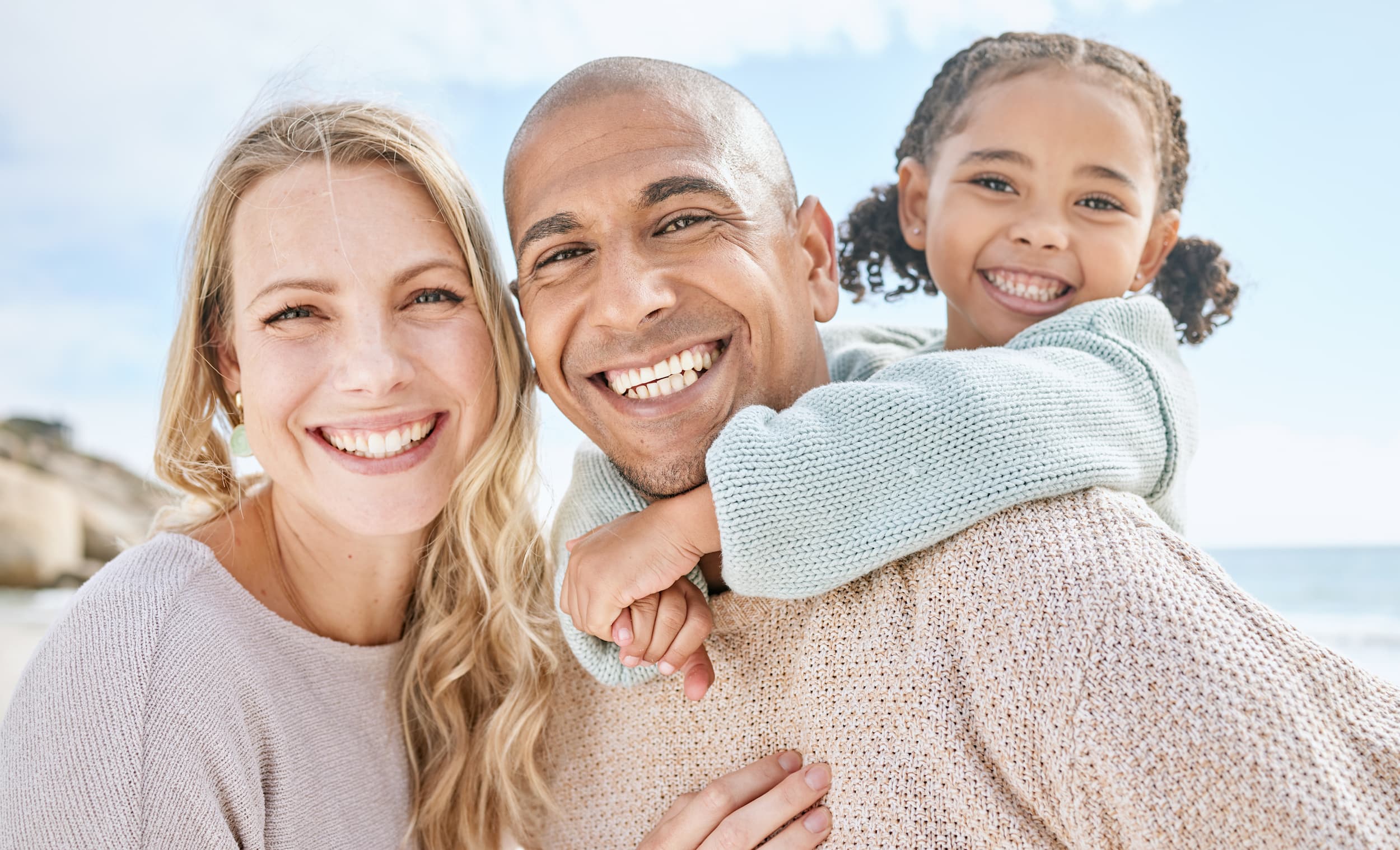 Smiling family enjoying healthy teeth and happy moments