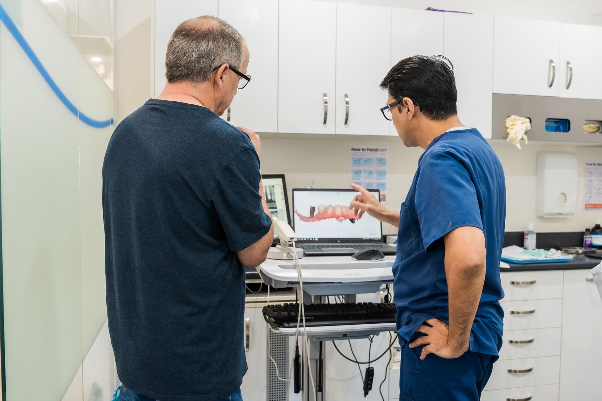Dr. Bhandare reviewing scan results with patient
