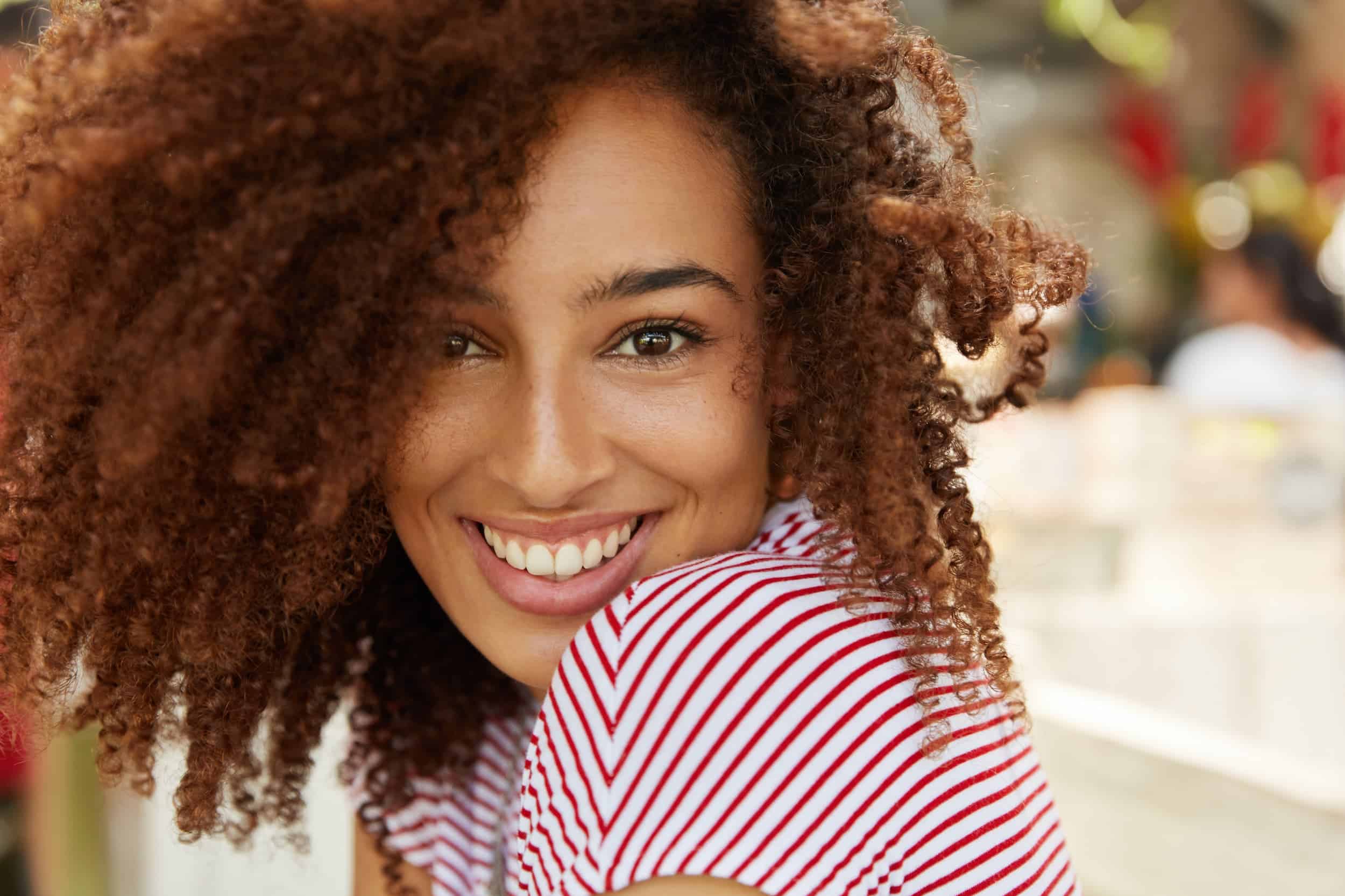 Confident woman smiling showing healthy white teeth