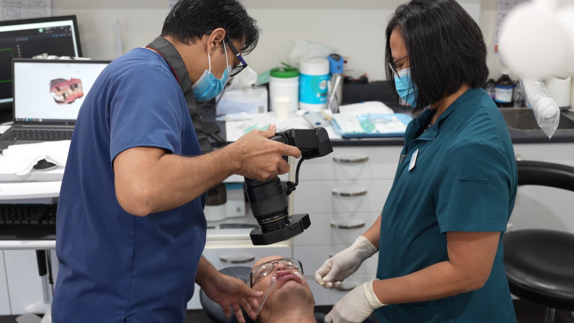 New patient receiving a comprehensive dental examination at Exquisite Smiles.